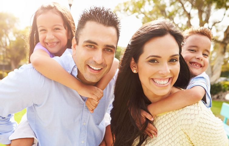Happy family that has received help from the Hispanic Counseling Center